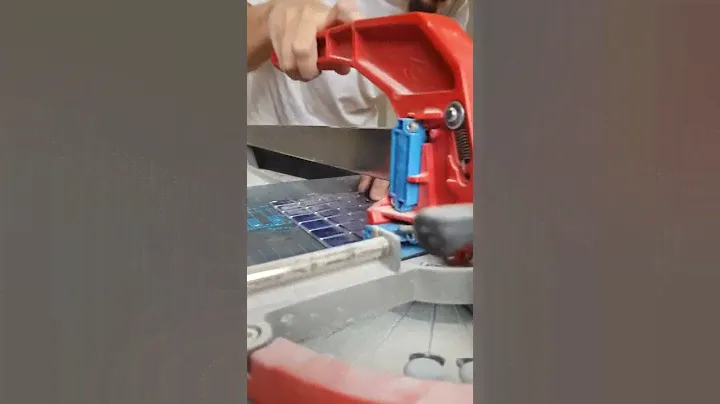 Tile setter using Montolit Rubber Mat to cut fragile glass mosaic fast